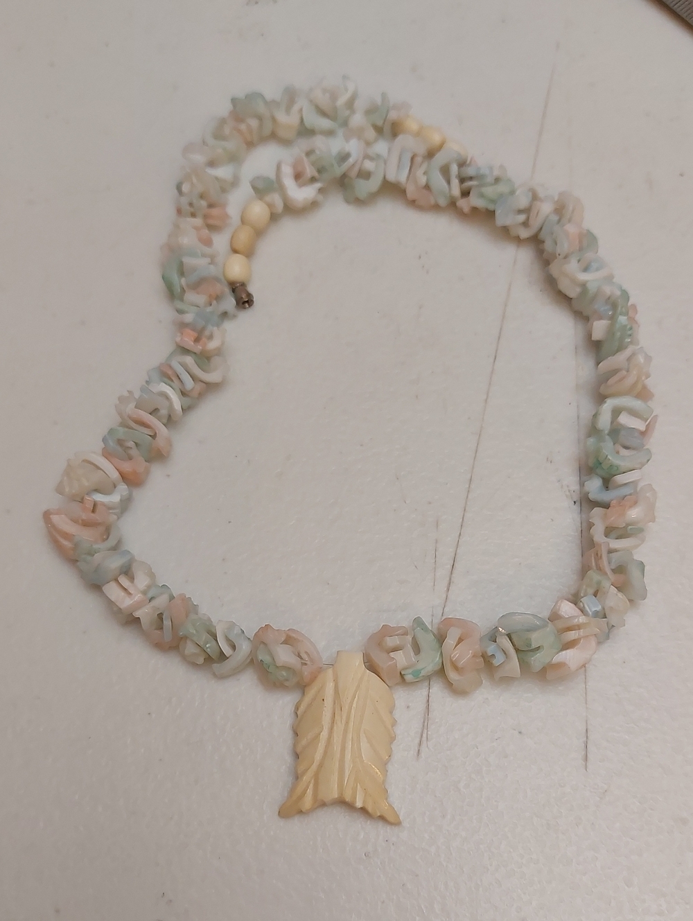 Handcrafted Pastel Colored Puka Shell Necklace Leaf Shaped Carved Bone Pendant